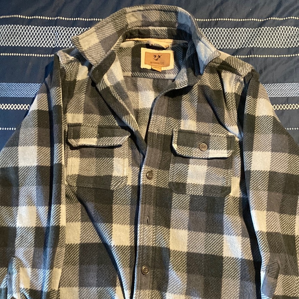 This is a long sleeves thick shirt that is size M of men.